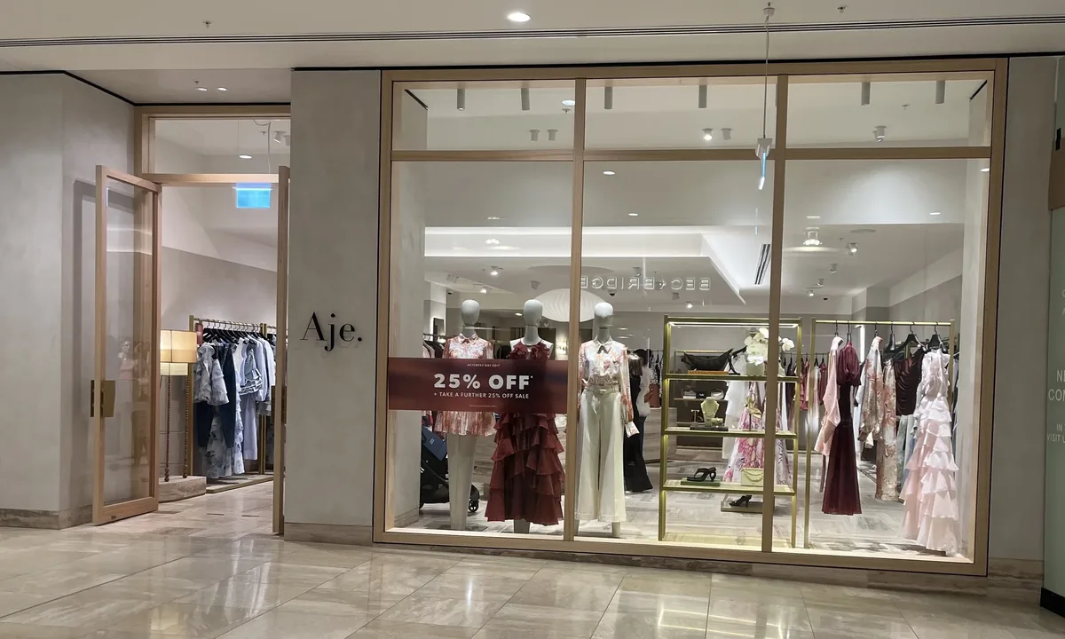 Slim-framed glass shopfront with a full-height retail display window