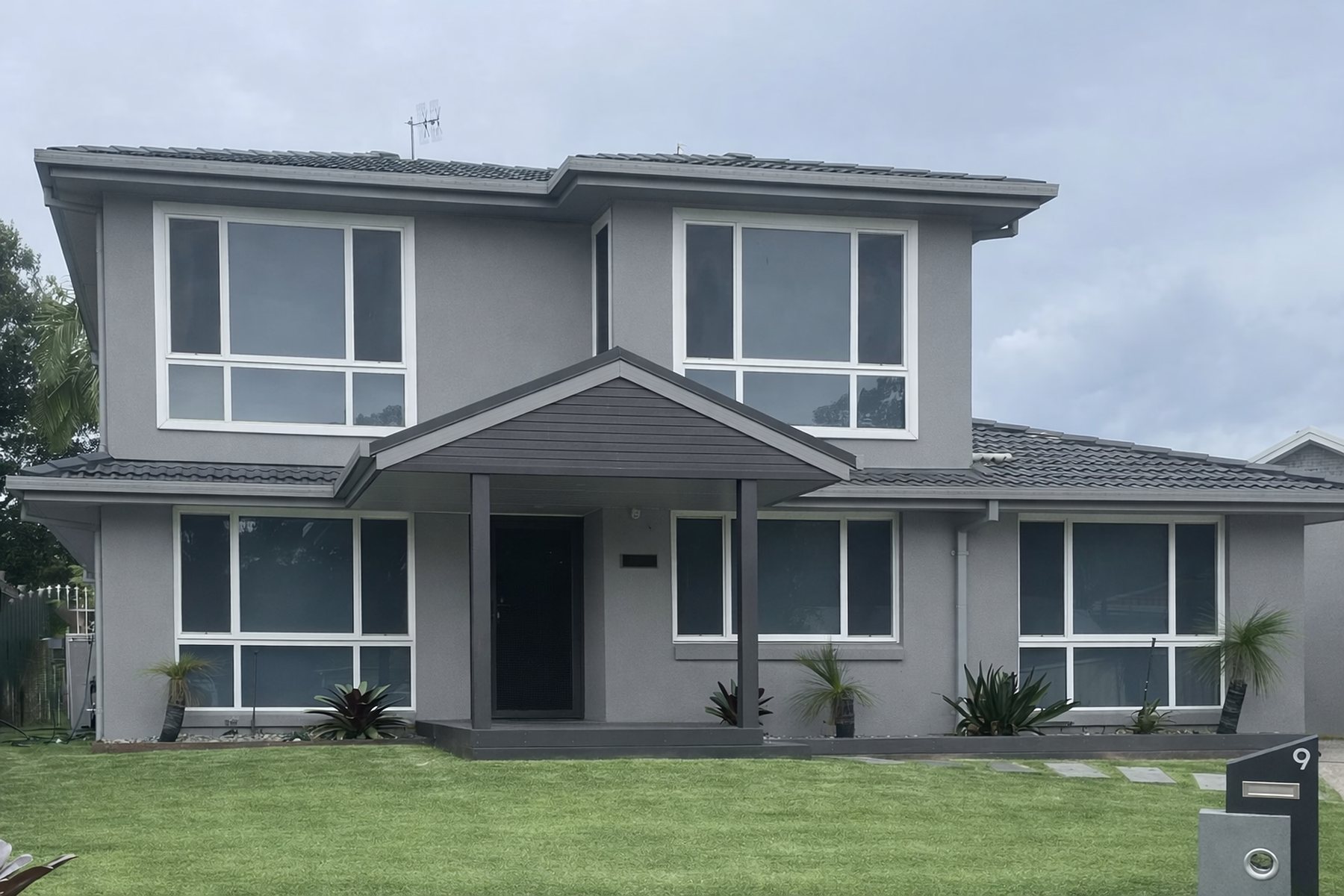 Aluminium-framed windows and glazed doors fitted to a home exterior
