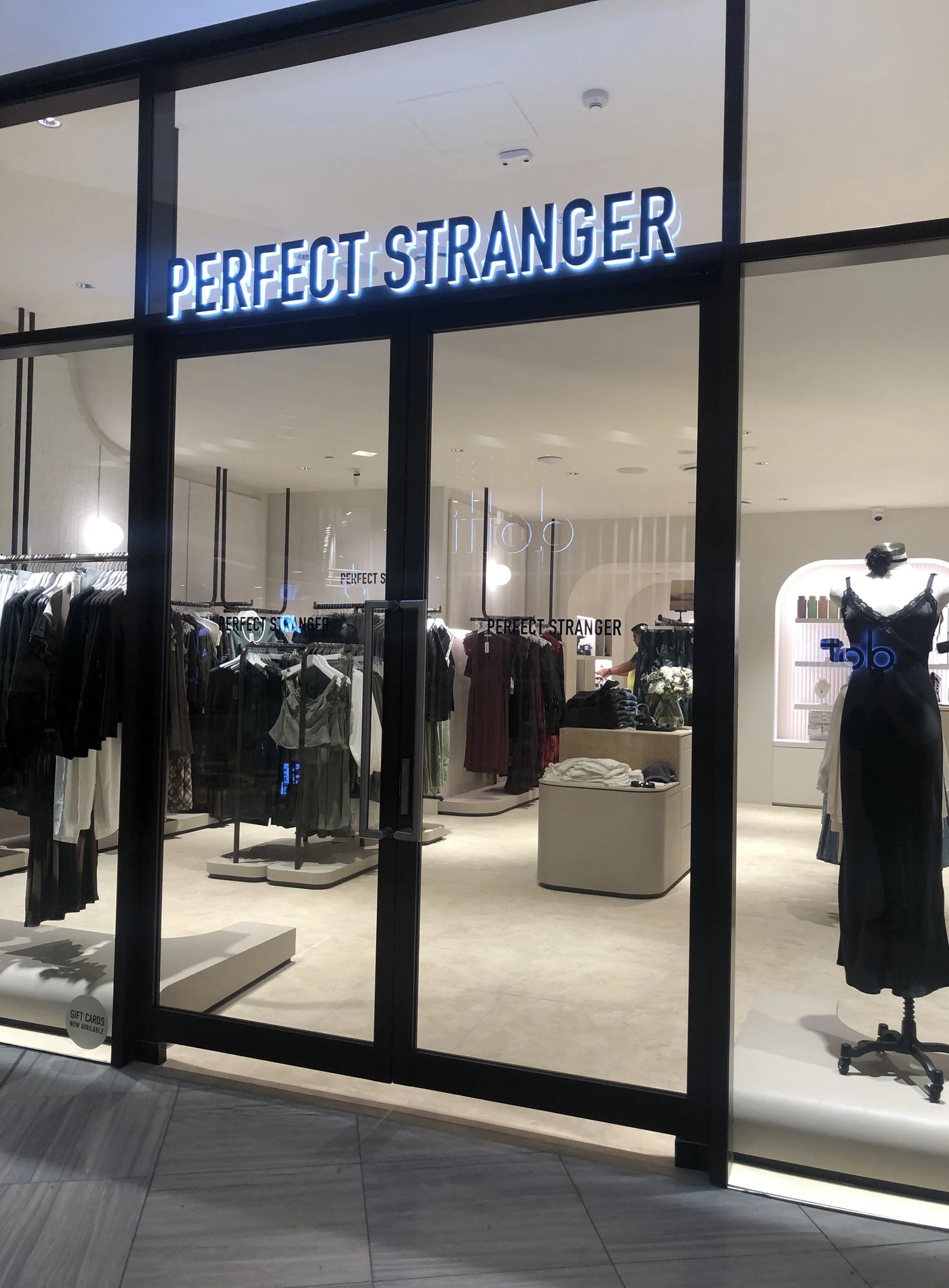 Aluminium-framed retail shopfront glazing fitted to a commercial fit-out