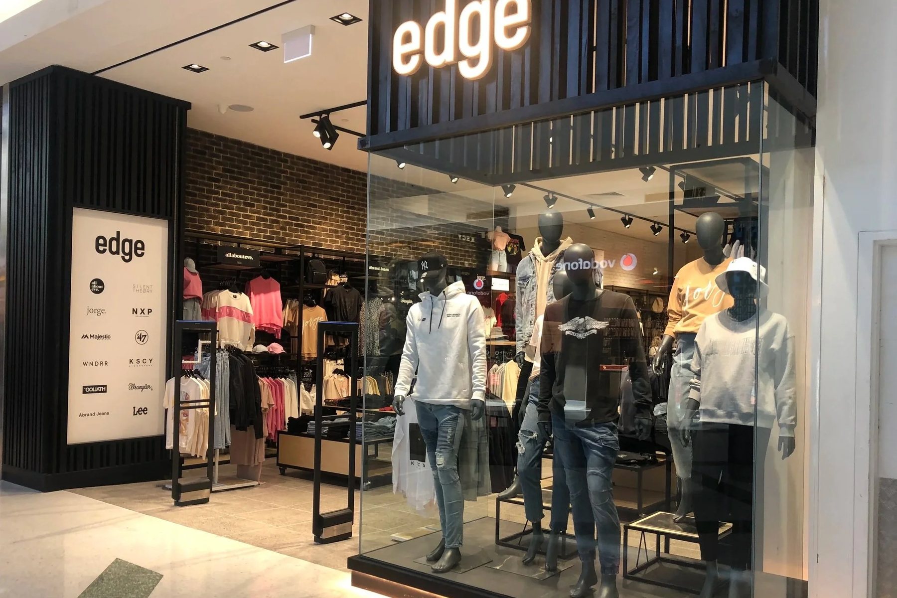 Full-height glazed retail frontage with slim aluminium framing